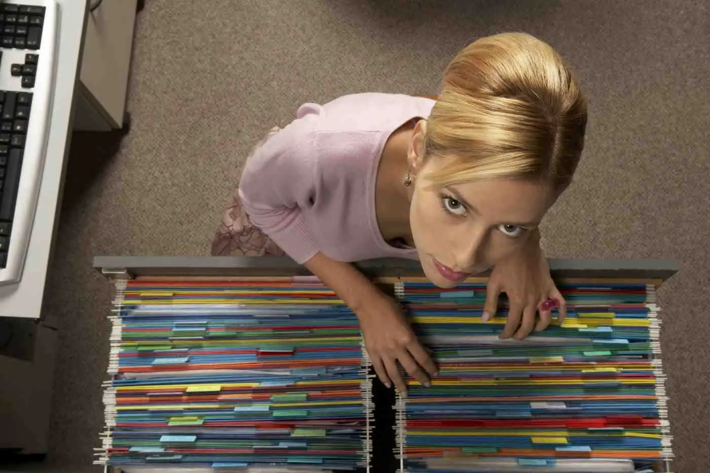 Woman organizing files meticulously, illustrating High Functioning OCD
