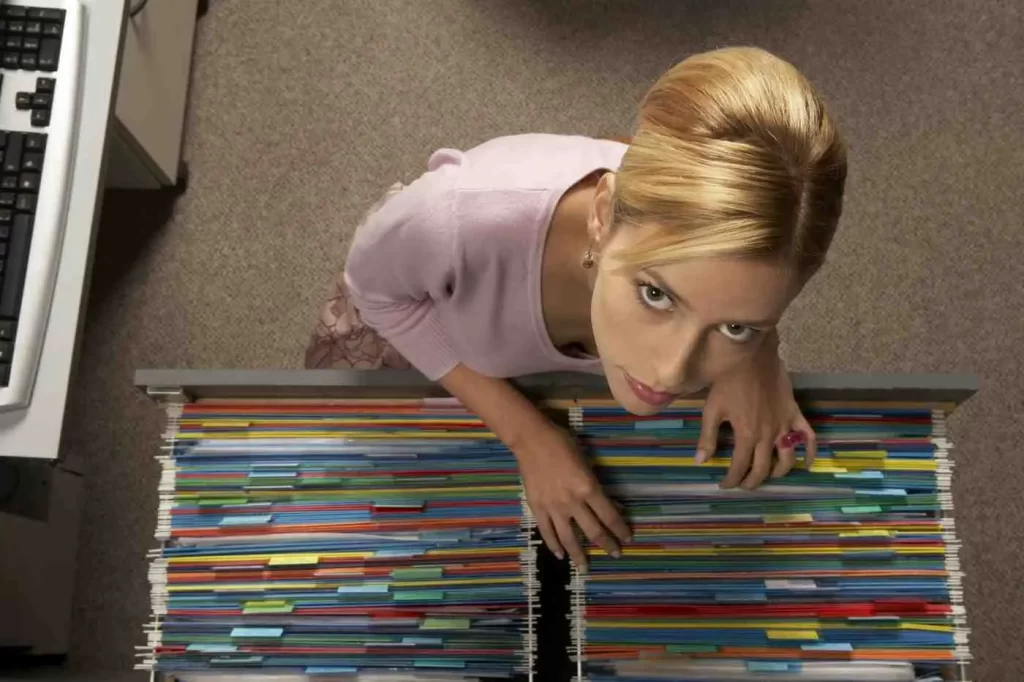 Woman organizing files meticulously, illustrating High Functioning OCD