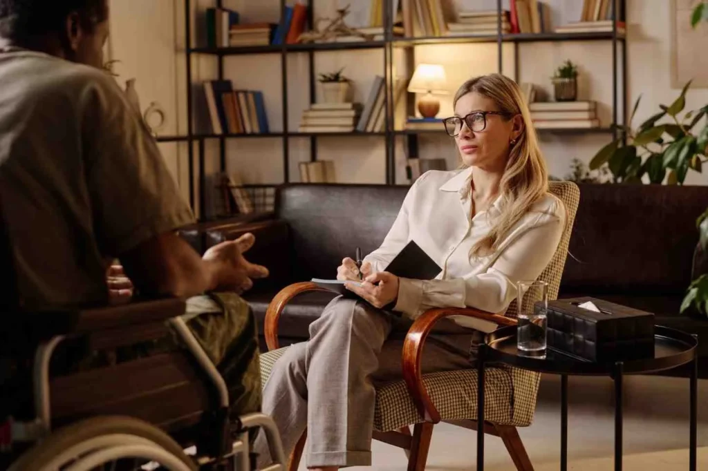 Therapist talking to patient during session showing emotional distress during EMDR and Limitations Of EMDR therapy including risks and effectiveness concerns